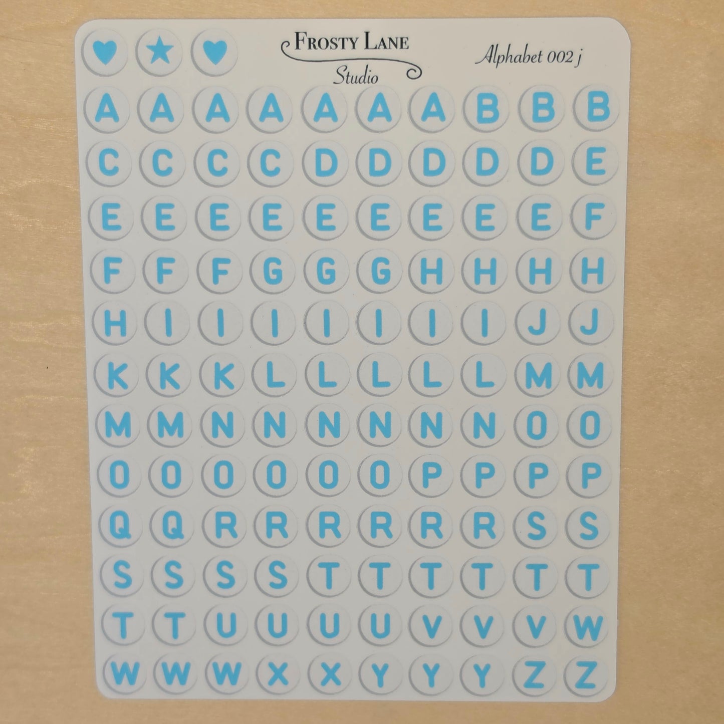 Alphabet 002.j. blue letters and white circle