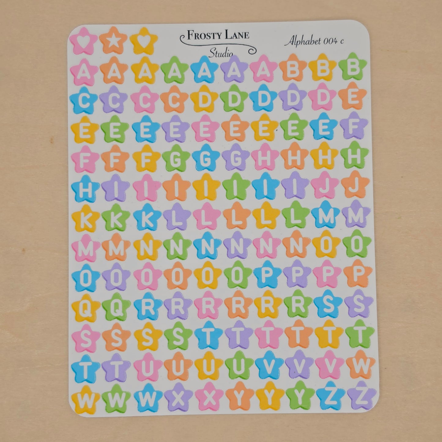 Alphabet 004.c white letters and rainbow star