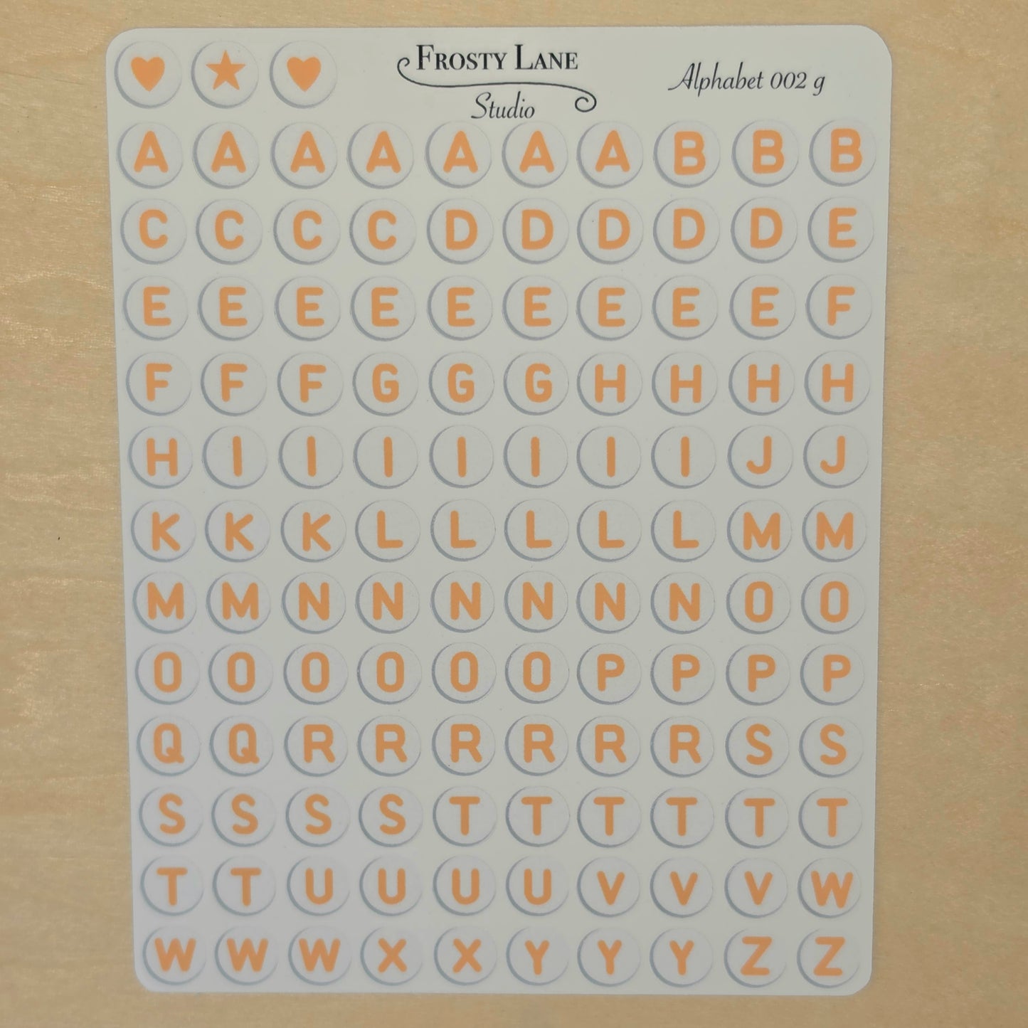 Alphabet 002.g. orange letters and white circle