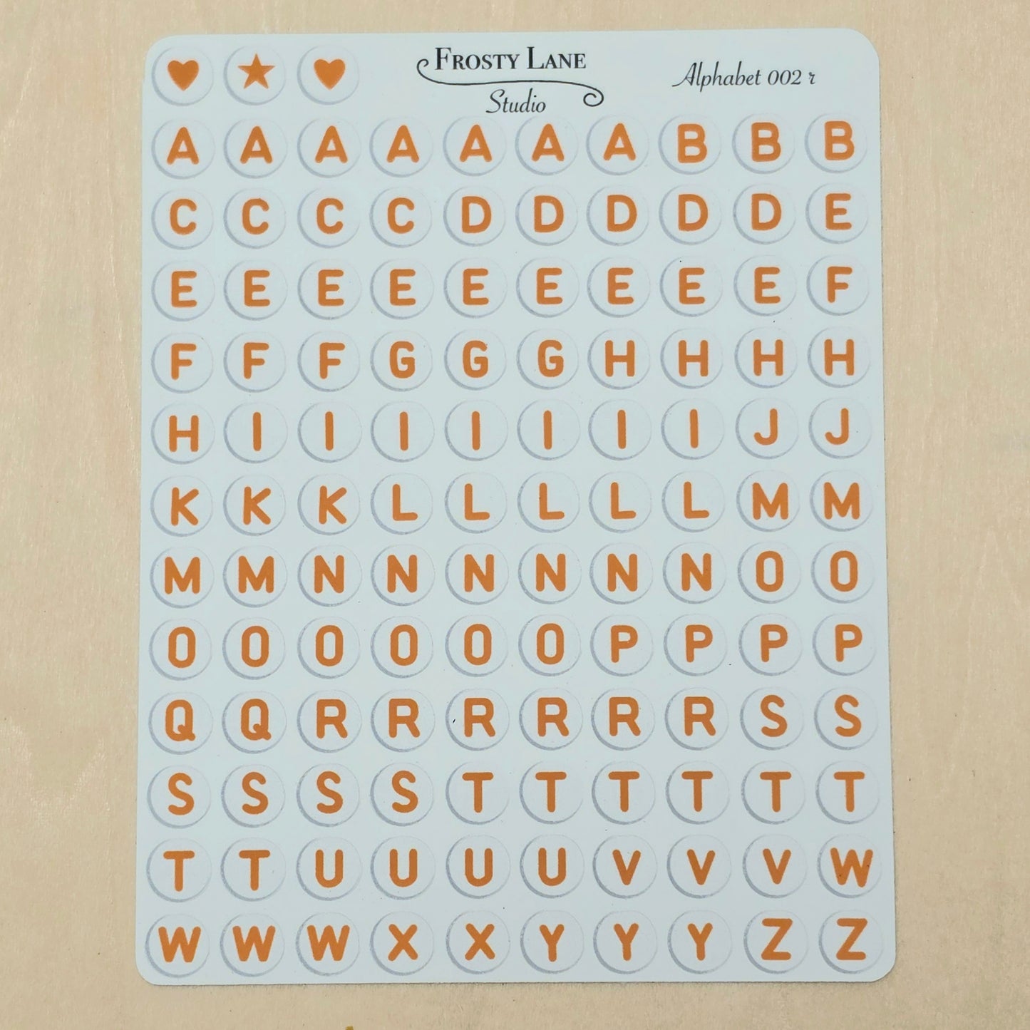 Alphabet 002.r. Brown letters and white circle