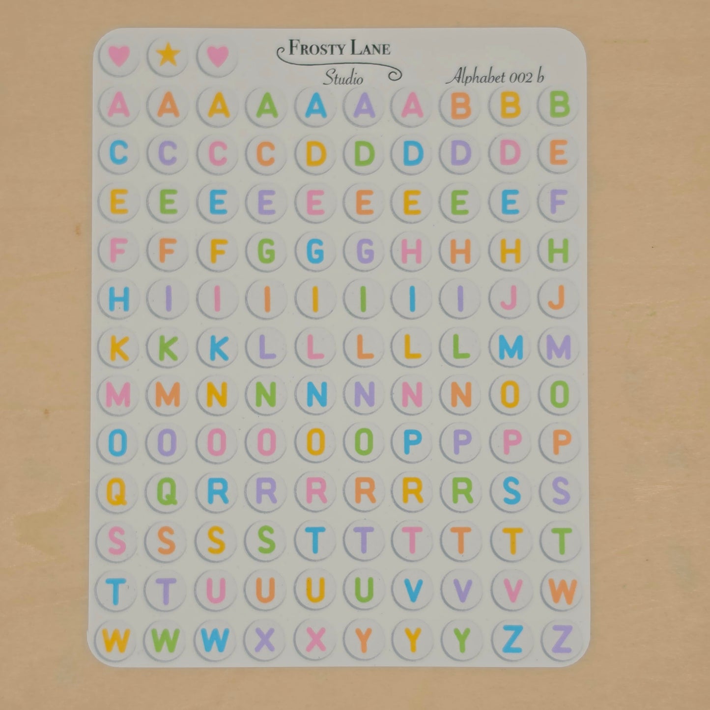 Alphabet 002.b. rainbow letters and white circle
