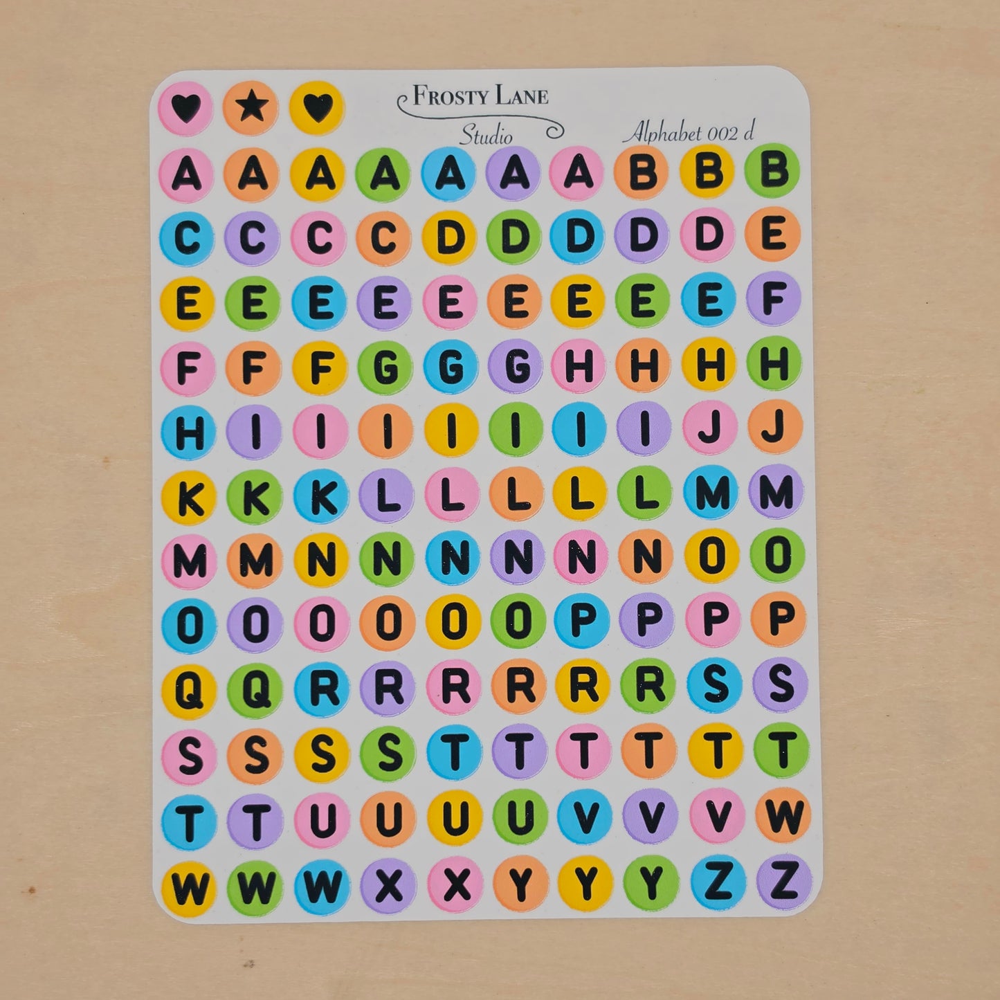 Alphabet 002.d. black letters and rainbow circle