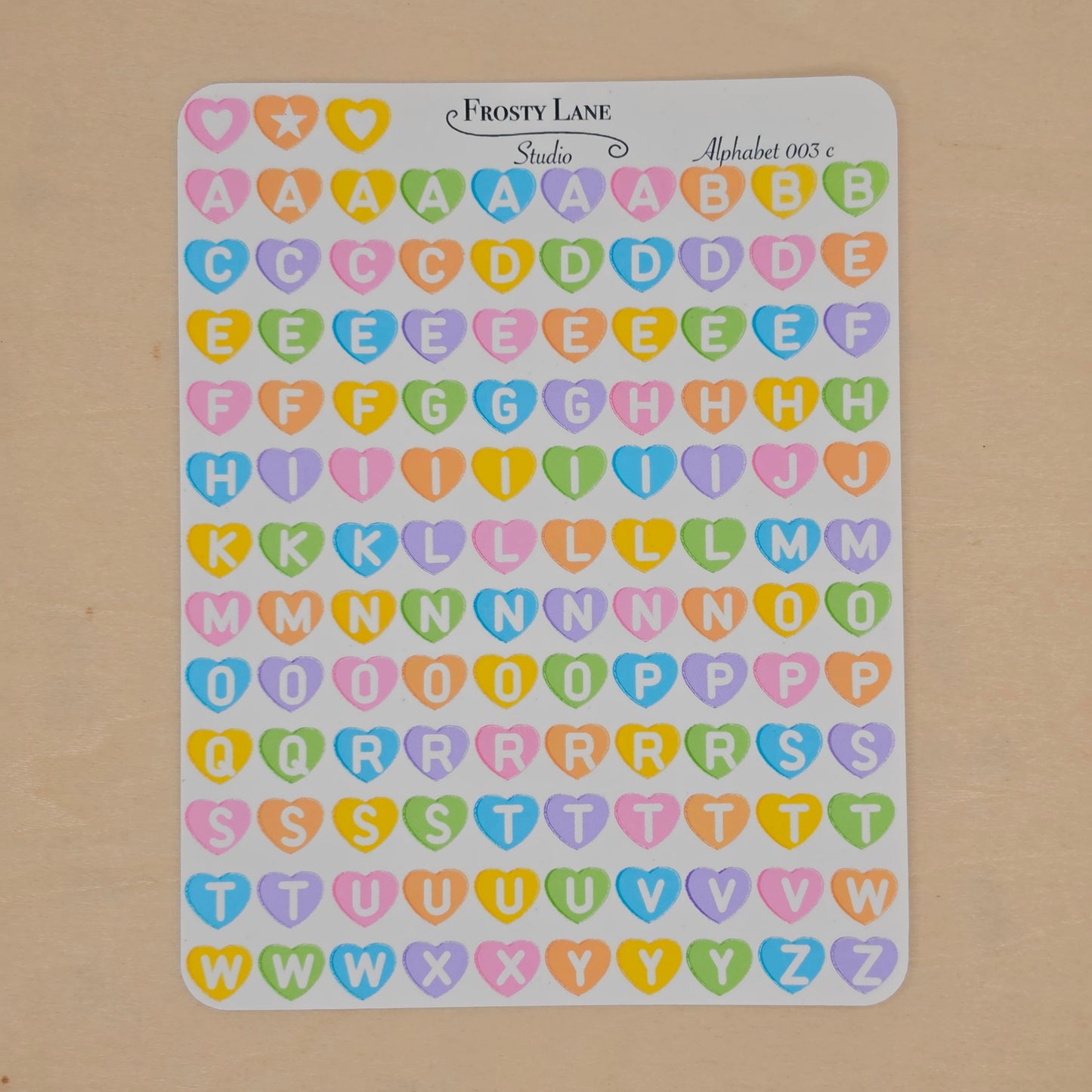 Alphabet 003.c white letters and rainbow heart