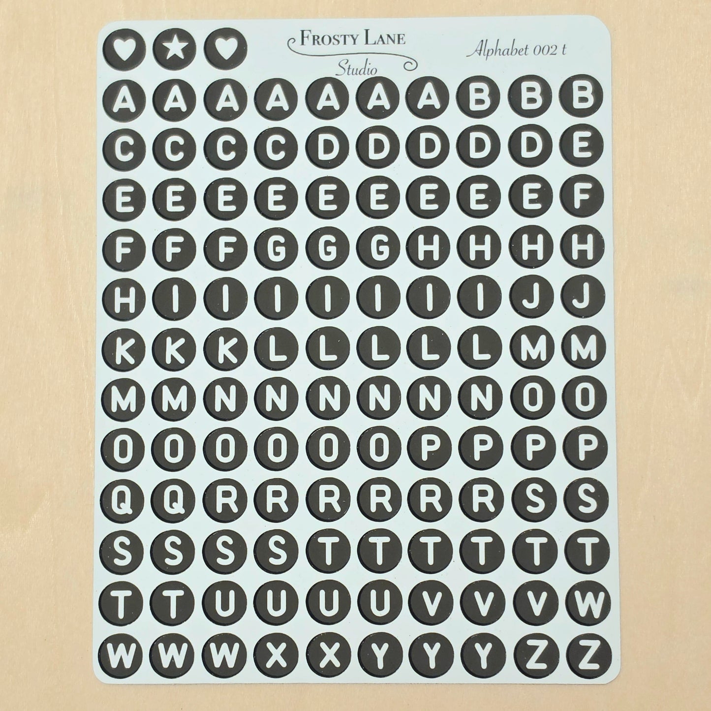 Alphabet 002.t. White letters and black circle
