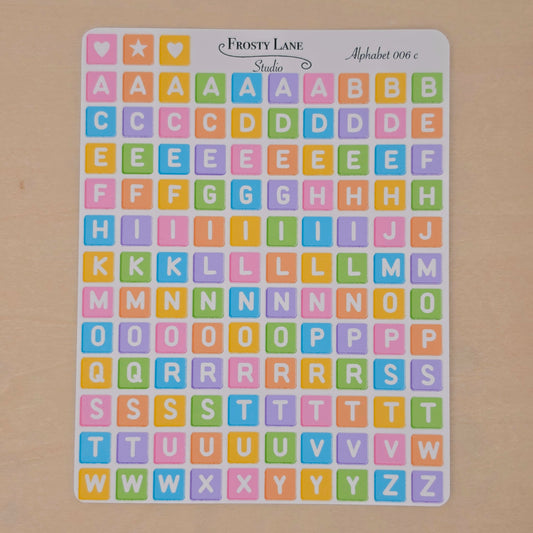 Alphabet 006.c white letters and rainbow square
