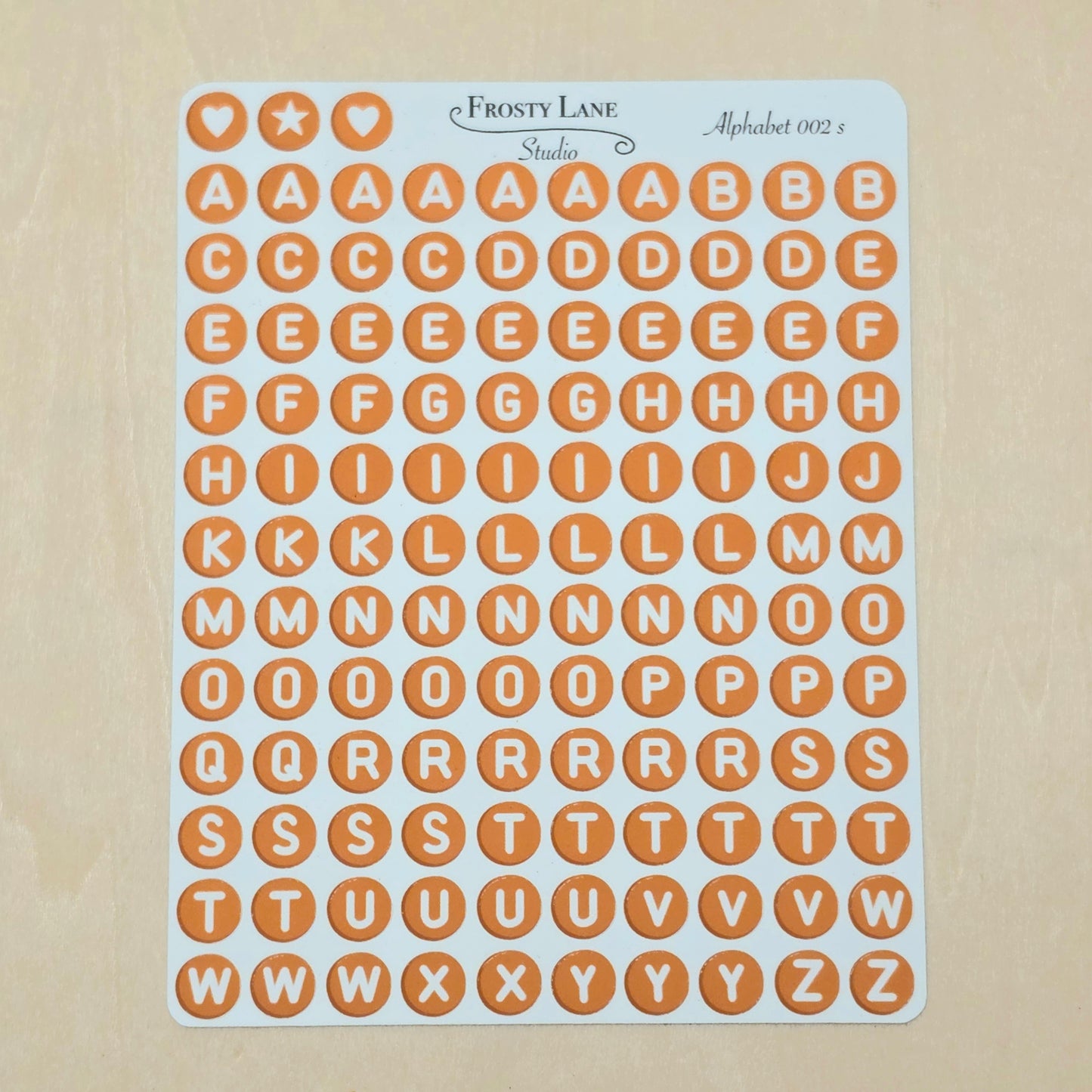 Alphabet 002.s. White letters and brown circle