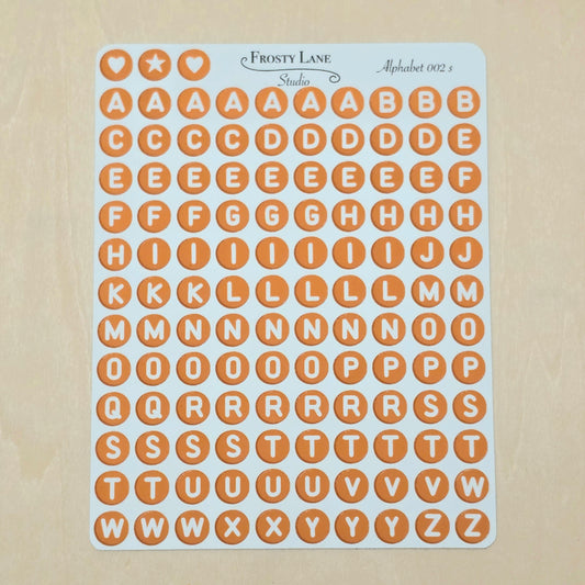 Alphabet 002.s. White letters and brown circle