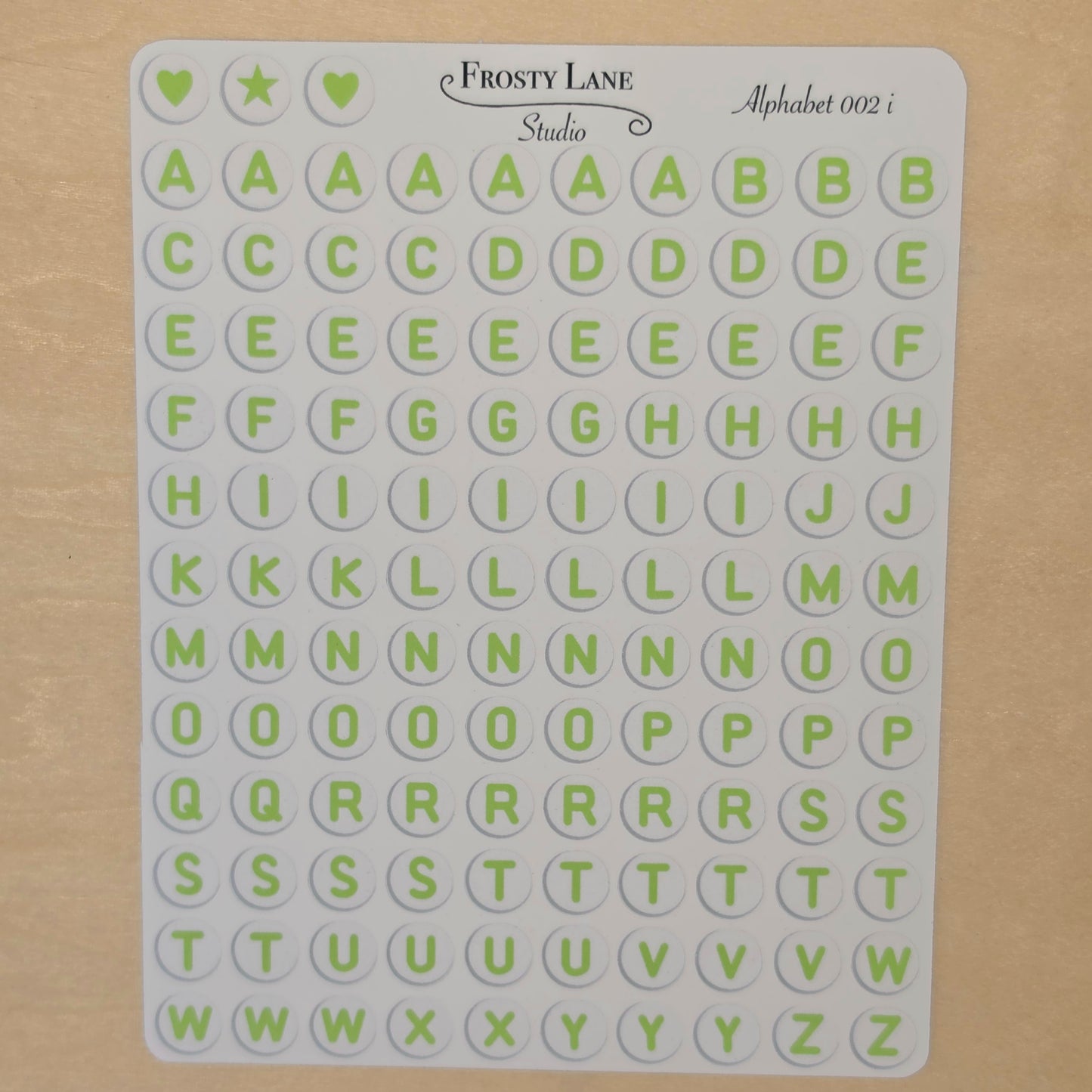 Alphabet 002.i. green letters and white circle
