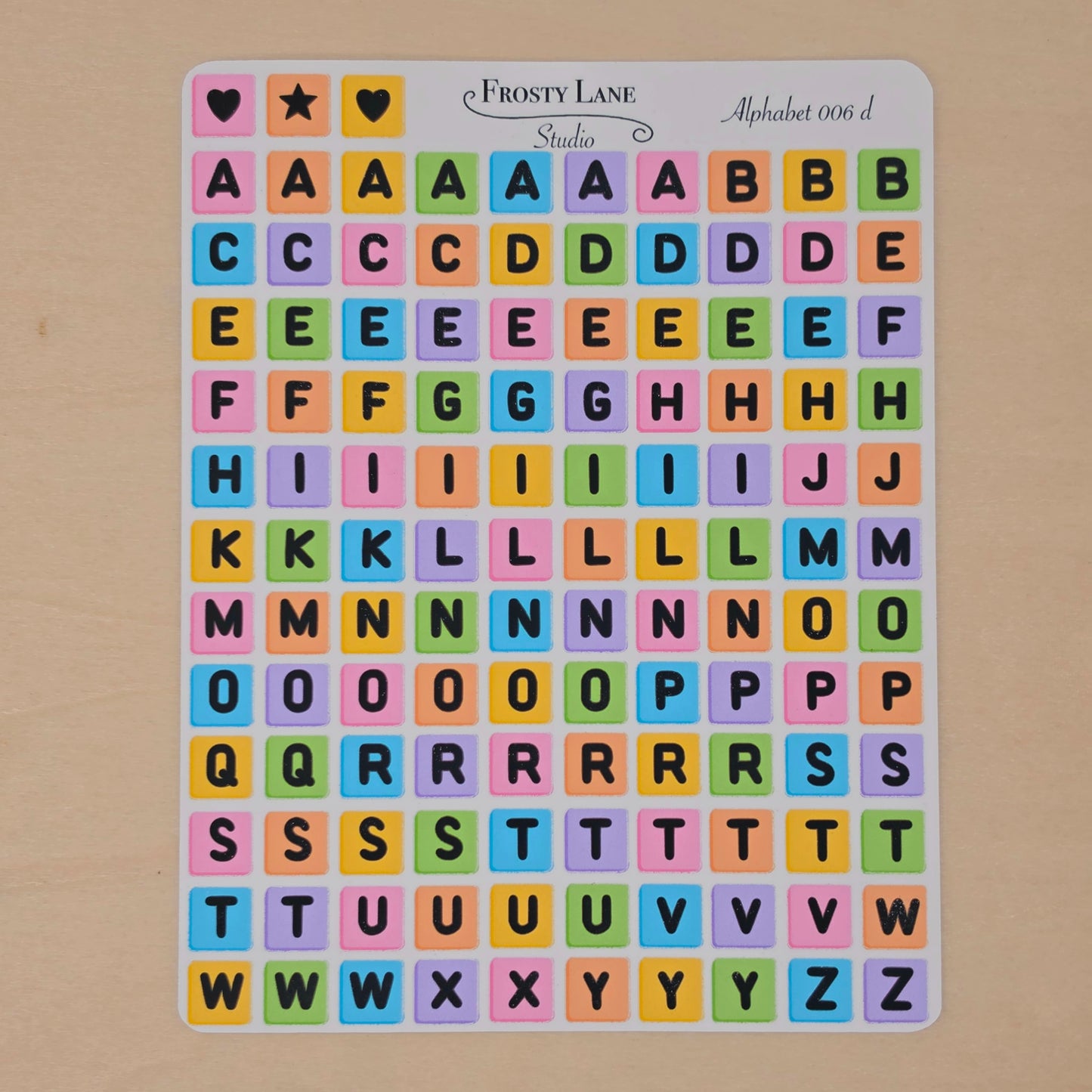 Alphabet 006.d black letters and rainbow square