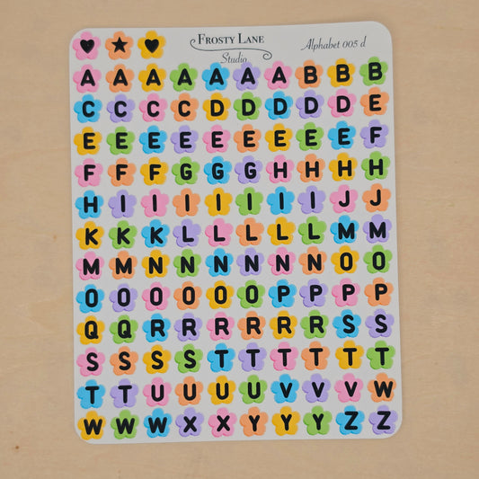 Alphabet 005.d. black letters and rainbow flower