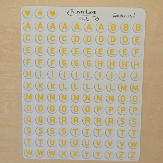 Alphabet 002.h. yellow letters and white circle