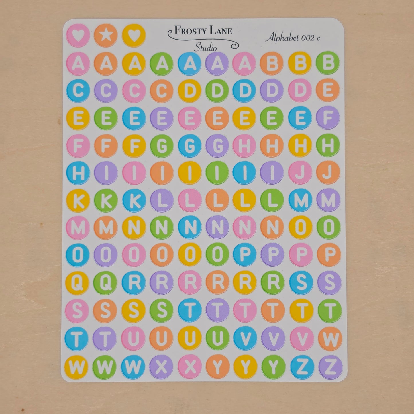 Alphabet 002.c. white letters and rainbow circle