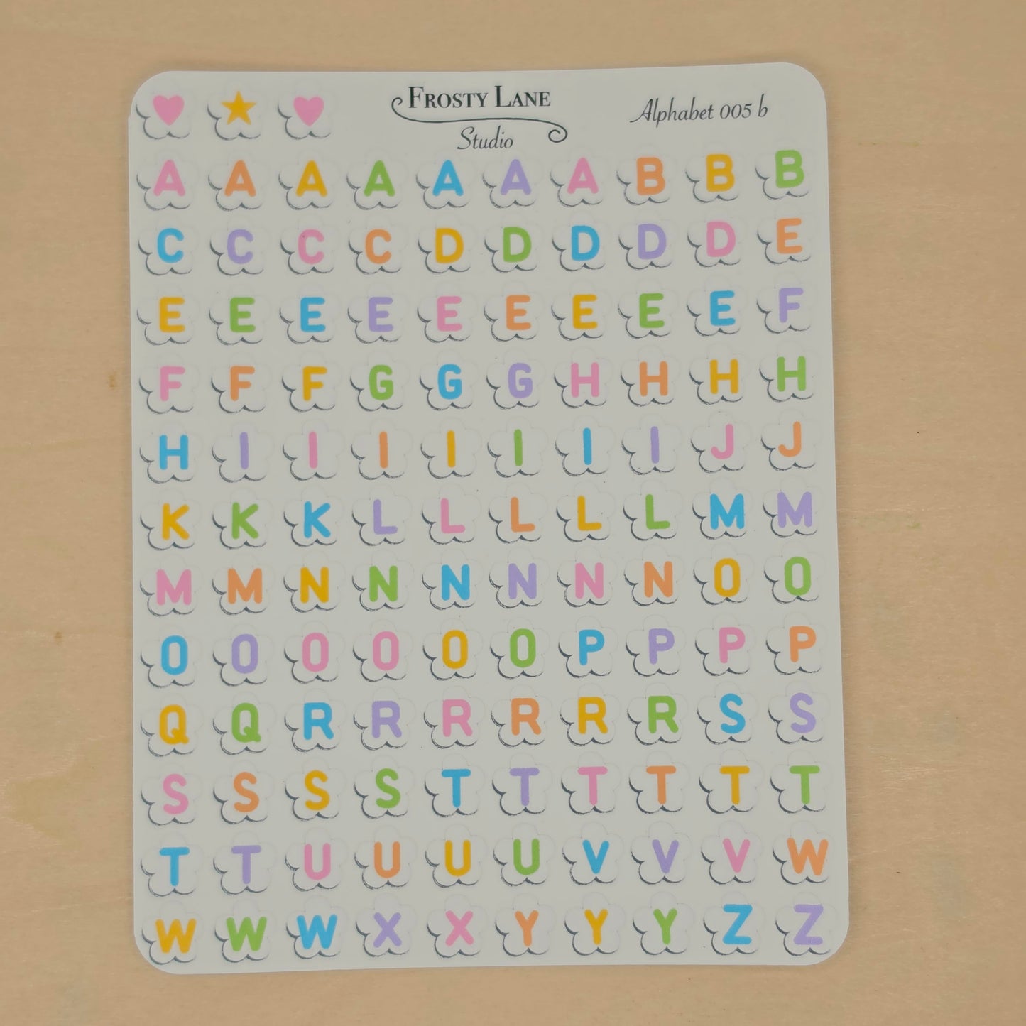 Alphabet 005.b. rainbow letters and white flower