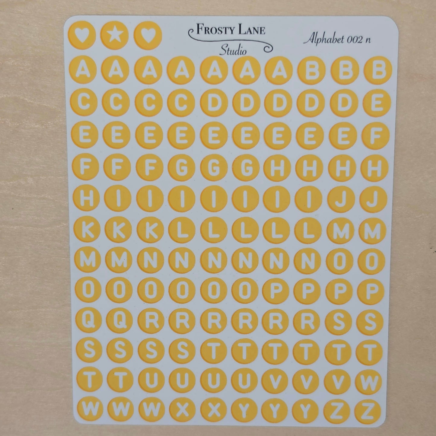 Alphabet 002.n. white letters and yellow circle