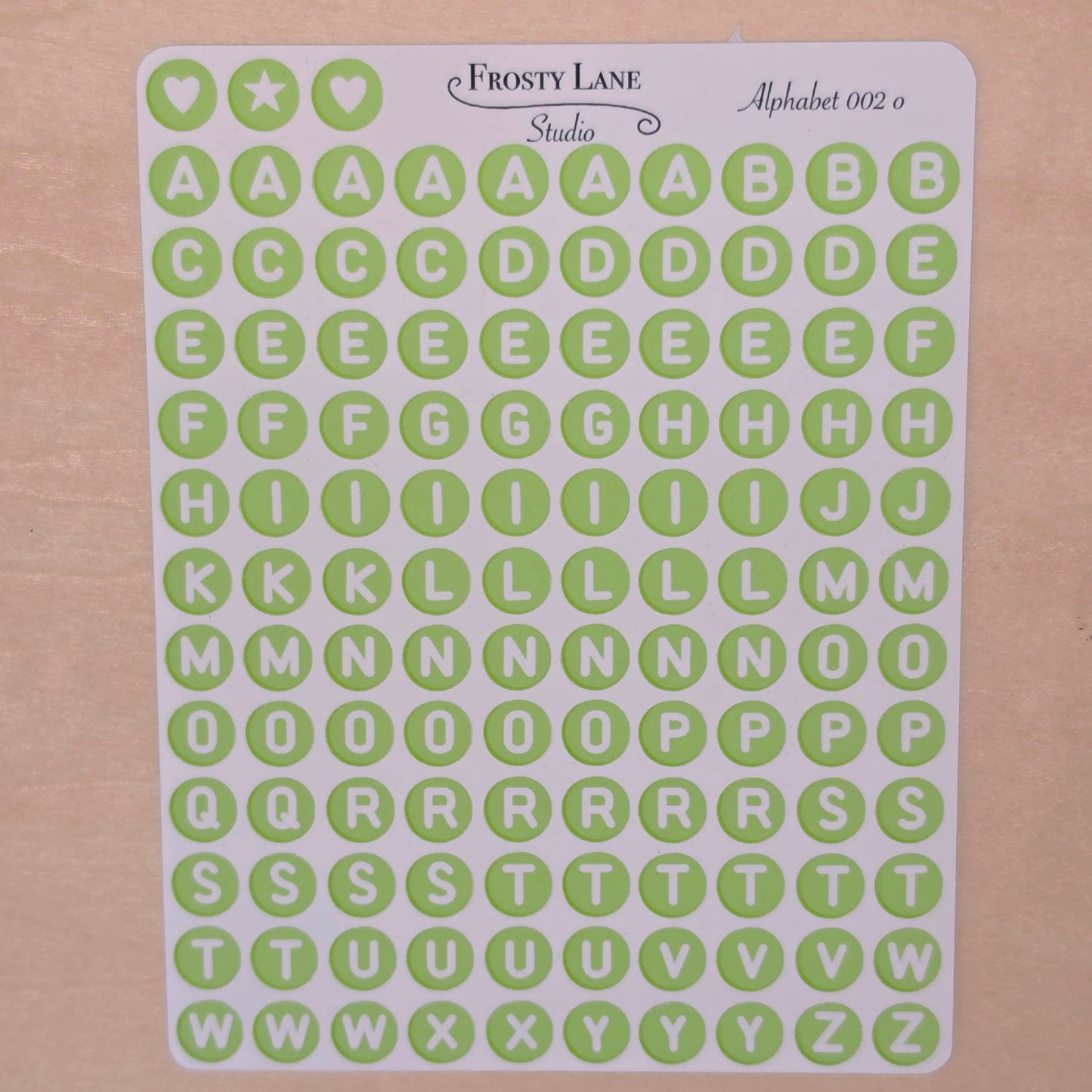 Alphabet 002.o. white letters and green circle